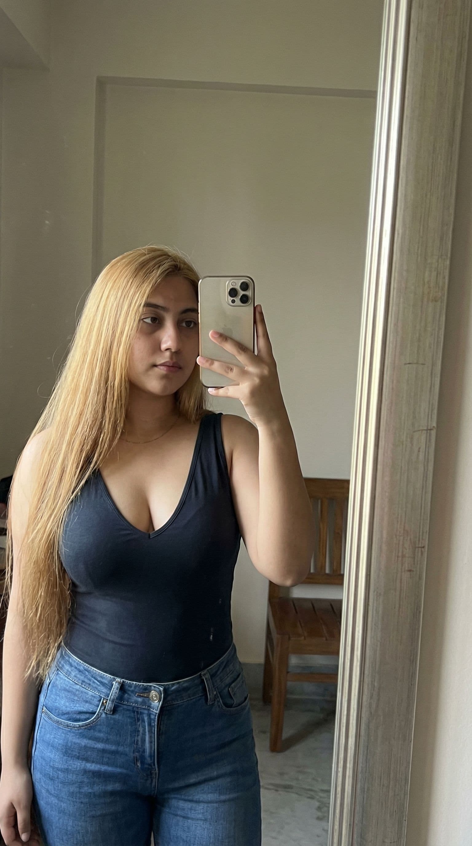 AI generated: the girl takes a photo with her phone of herself in the mirror, she has 18 years old, has straight b...