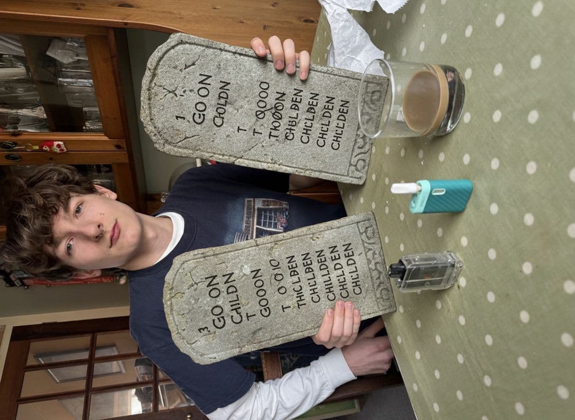 AI generated: Boy holding up the Ten Commandments but they all say goon to children instead of the actual ten comm...