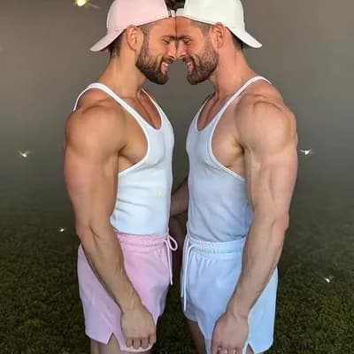 AI generated video: 
Make these men standing in mossy field while foreheads pressed against one another's looking into e...