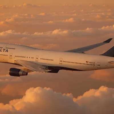AI generated video: Ultra high detail video of the plane flying dark orange sunlit clouds.