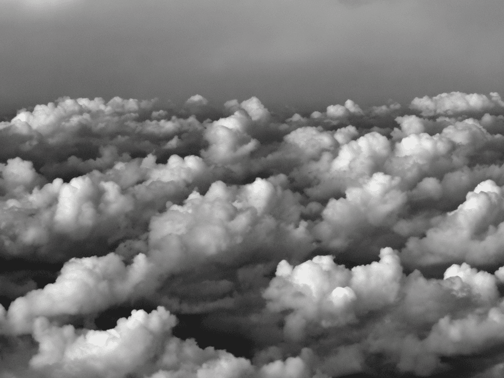 AI generated: full sky of flat anime disney simple texture cartoonish multiple flat stormy clouds in greyscale