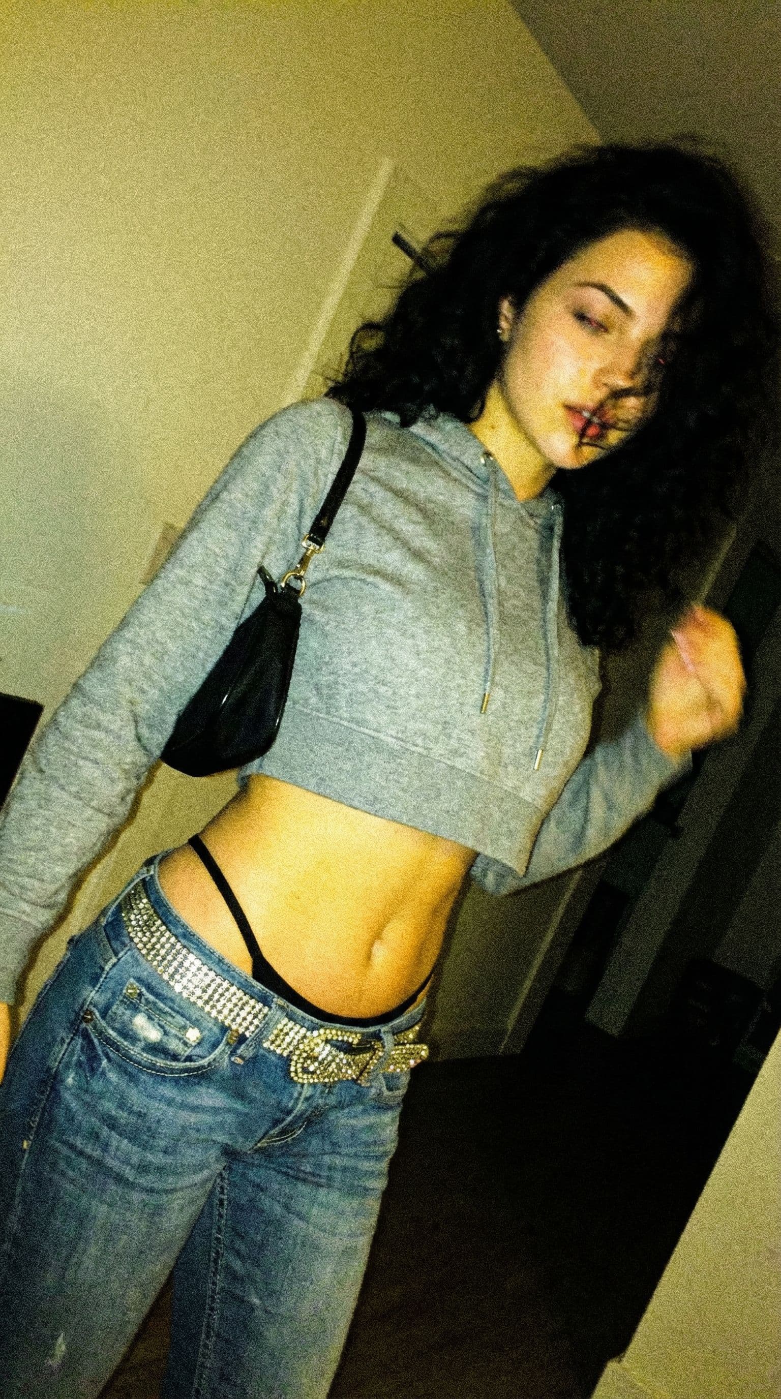 AI generated: a lo-fi 2015s-era, diagonally taken, low-quality iPhone photo of a 20-year-old baddie. The shot is i...