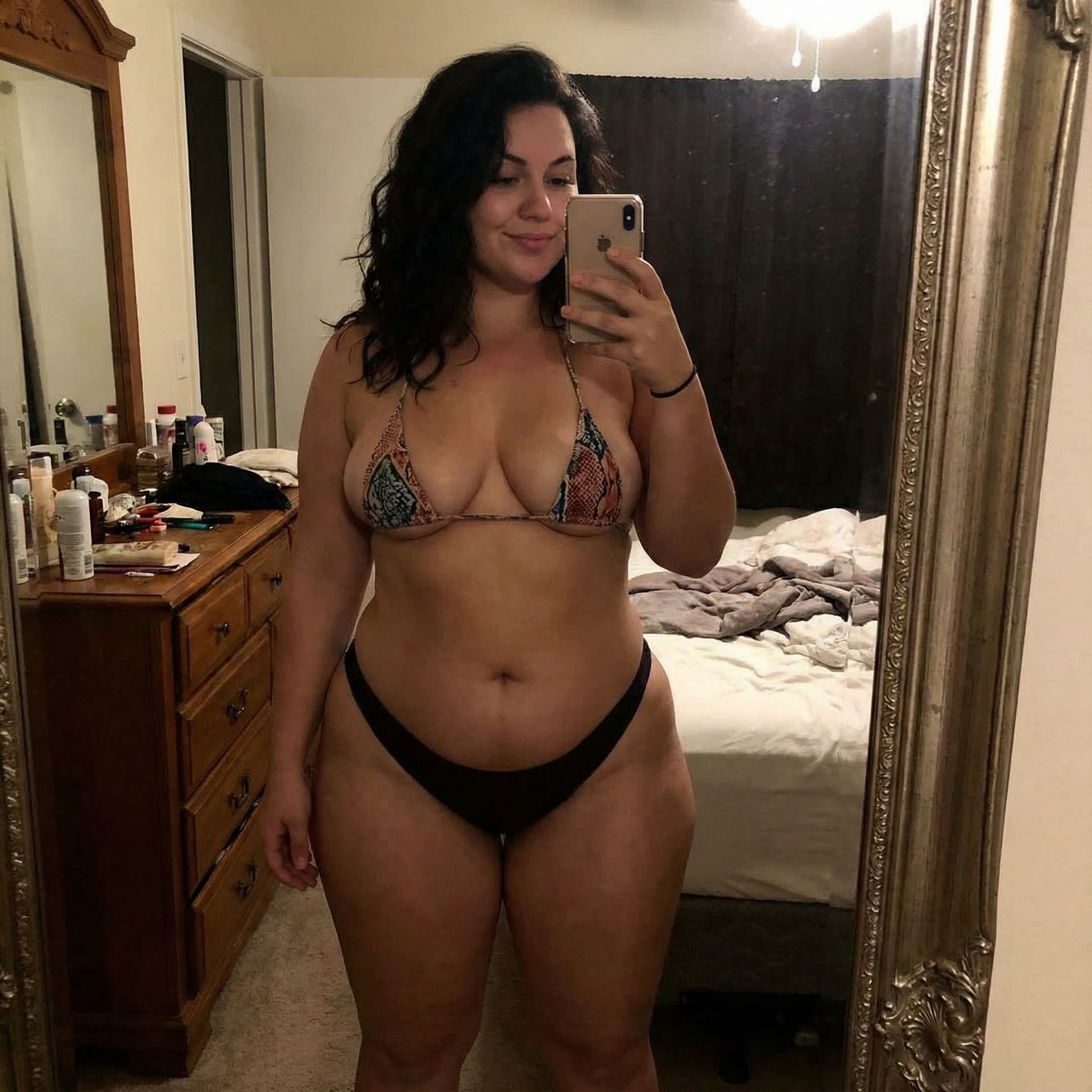 AI generated: a women whos body shape and size is similar to that of ava addams taking a mirror selfie wearing not...