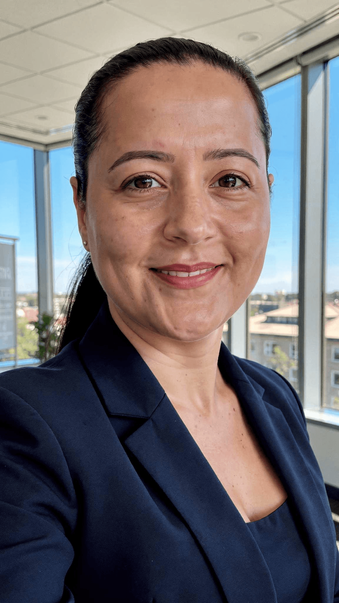 AI generated: generate a LinkedIn professional profile photo, wearing a beautiful navy blue blazer, beautiful offi...