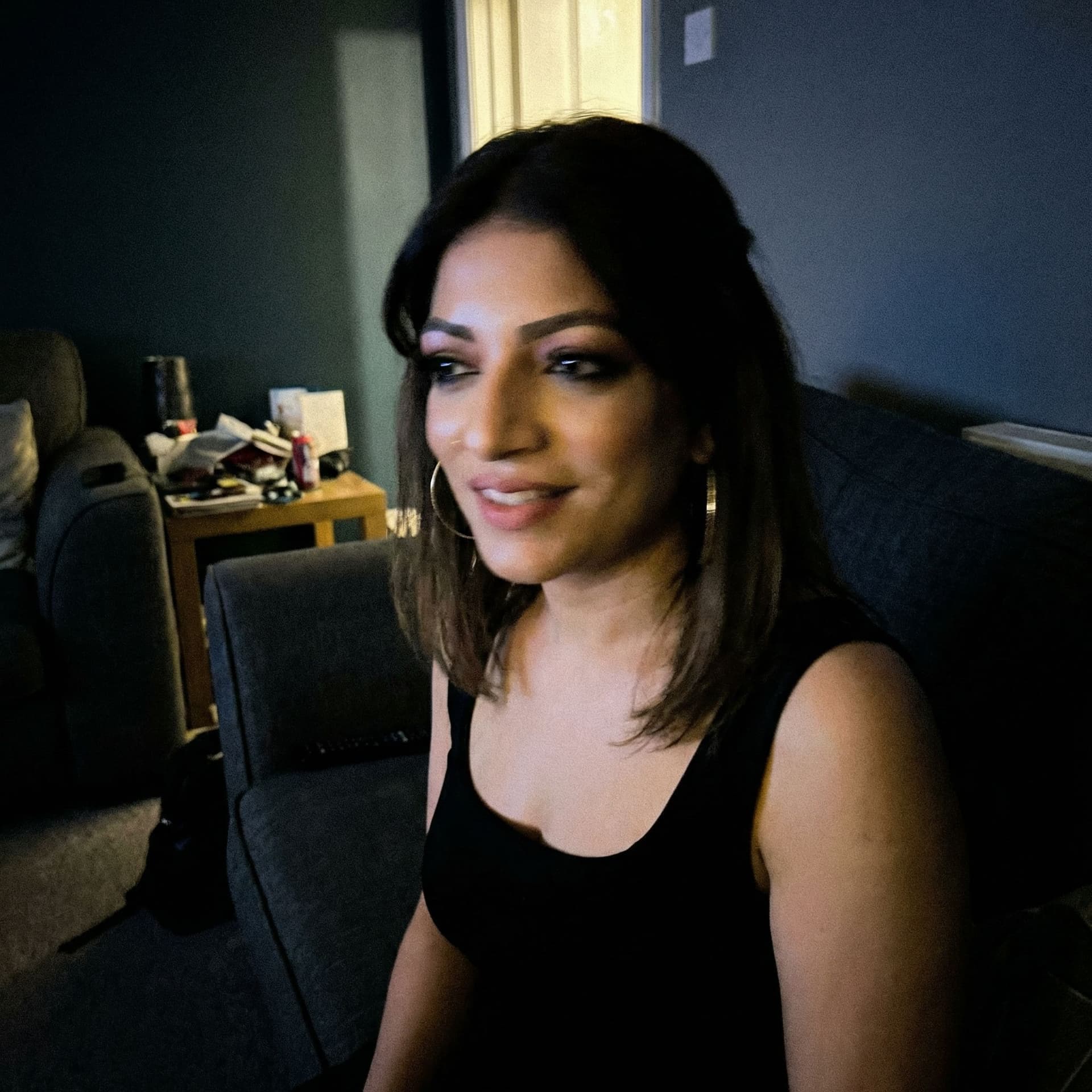 AI generated: Using the uploaded reference photo, takea standard iPhone photo of her. There's no clear subject or ...