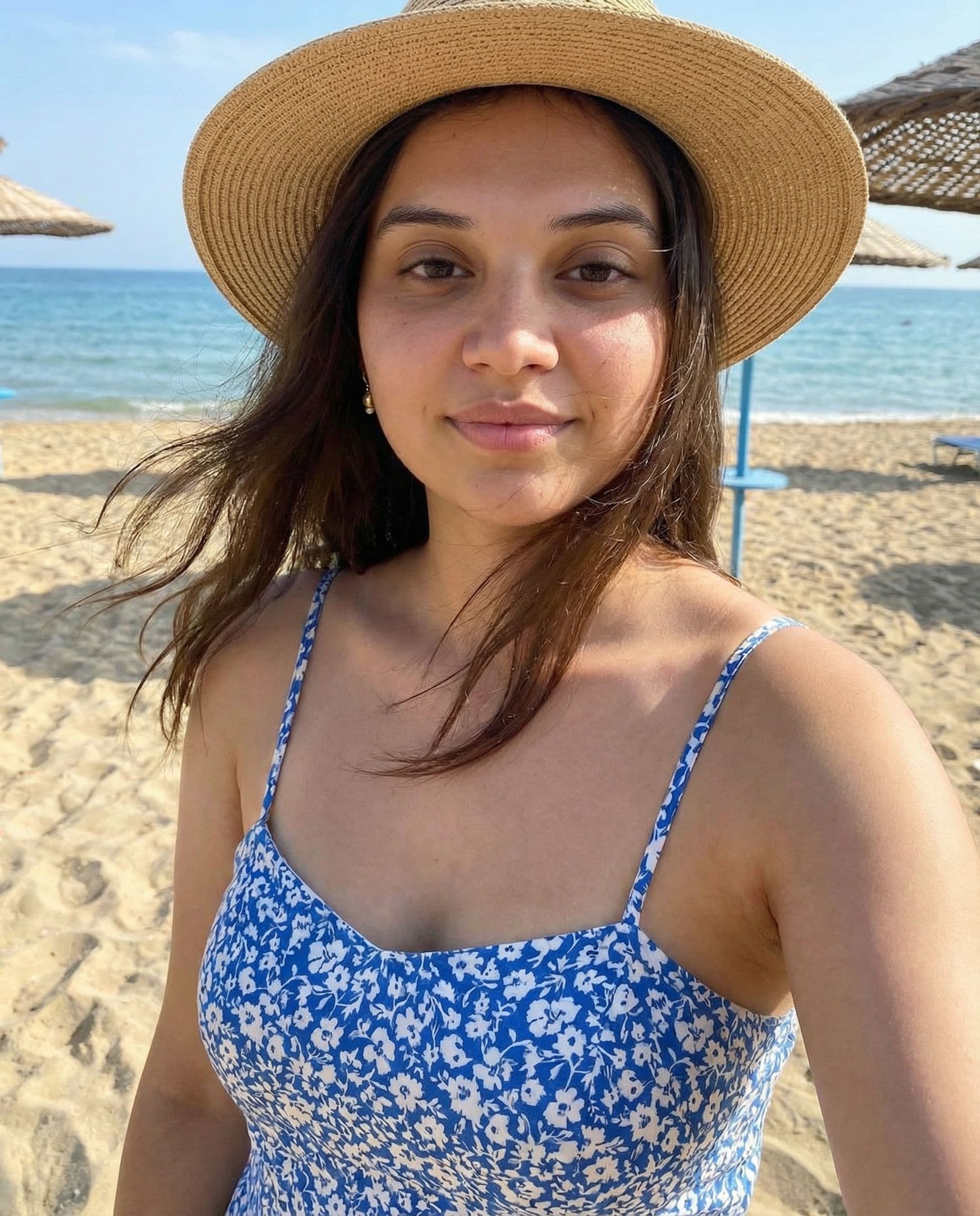 AI generated: Make her to wear a beach wear dress