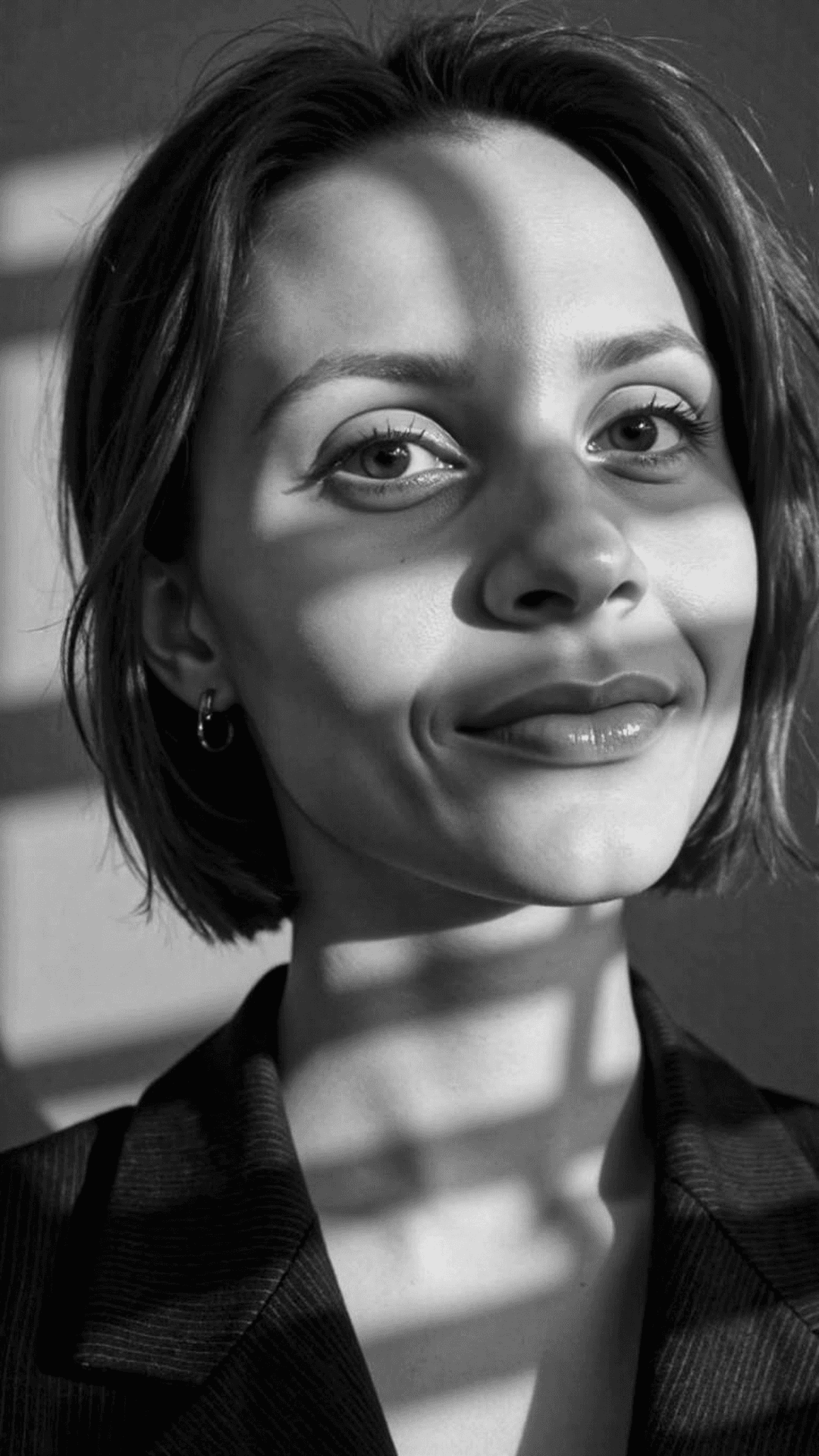AI generated: Close-up portrait of a woman illuminated by soft, warm afternoon light streaming through window blin...