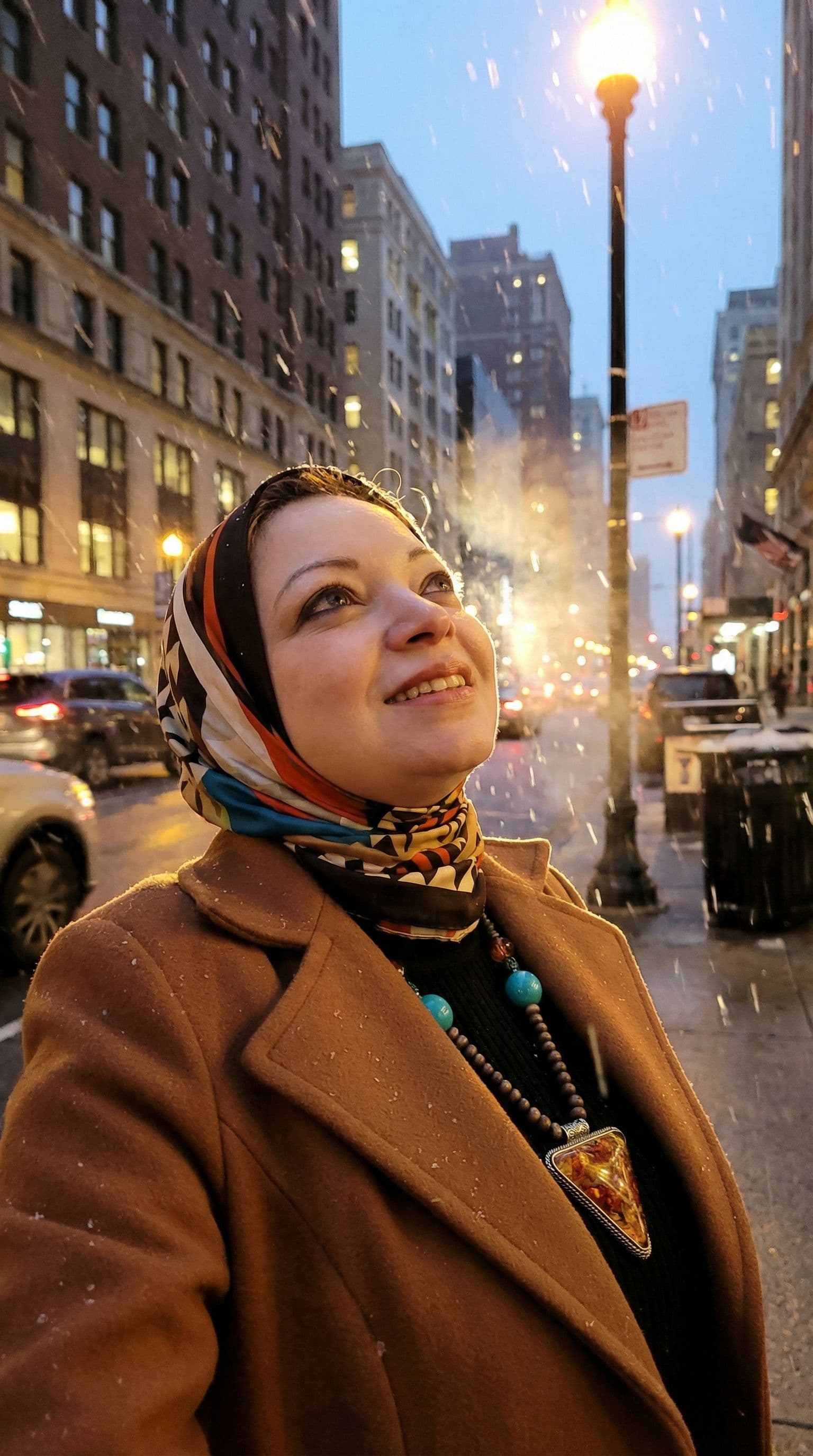 AI generated: The uploaded woman looking up as snow falls amidst city lights at dusk,  highres, realistic photo, p...