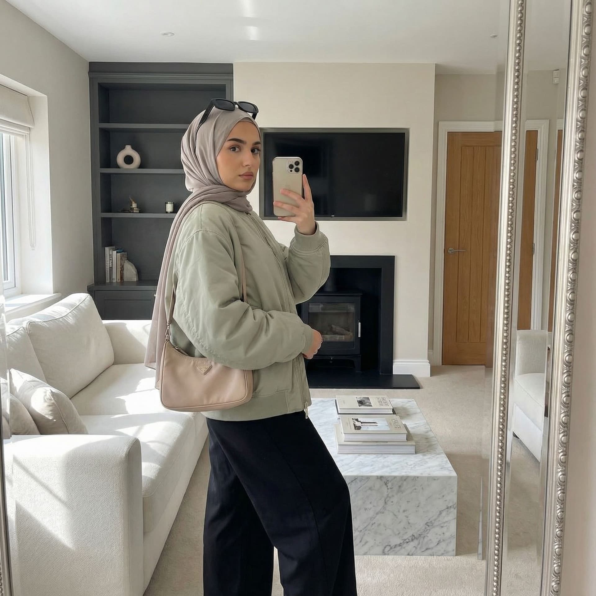 AI generated: A highly realistic, ultra-detailed indoor mirror selfie of a young hijabi woman standing in a modern...