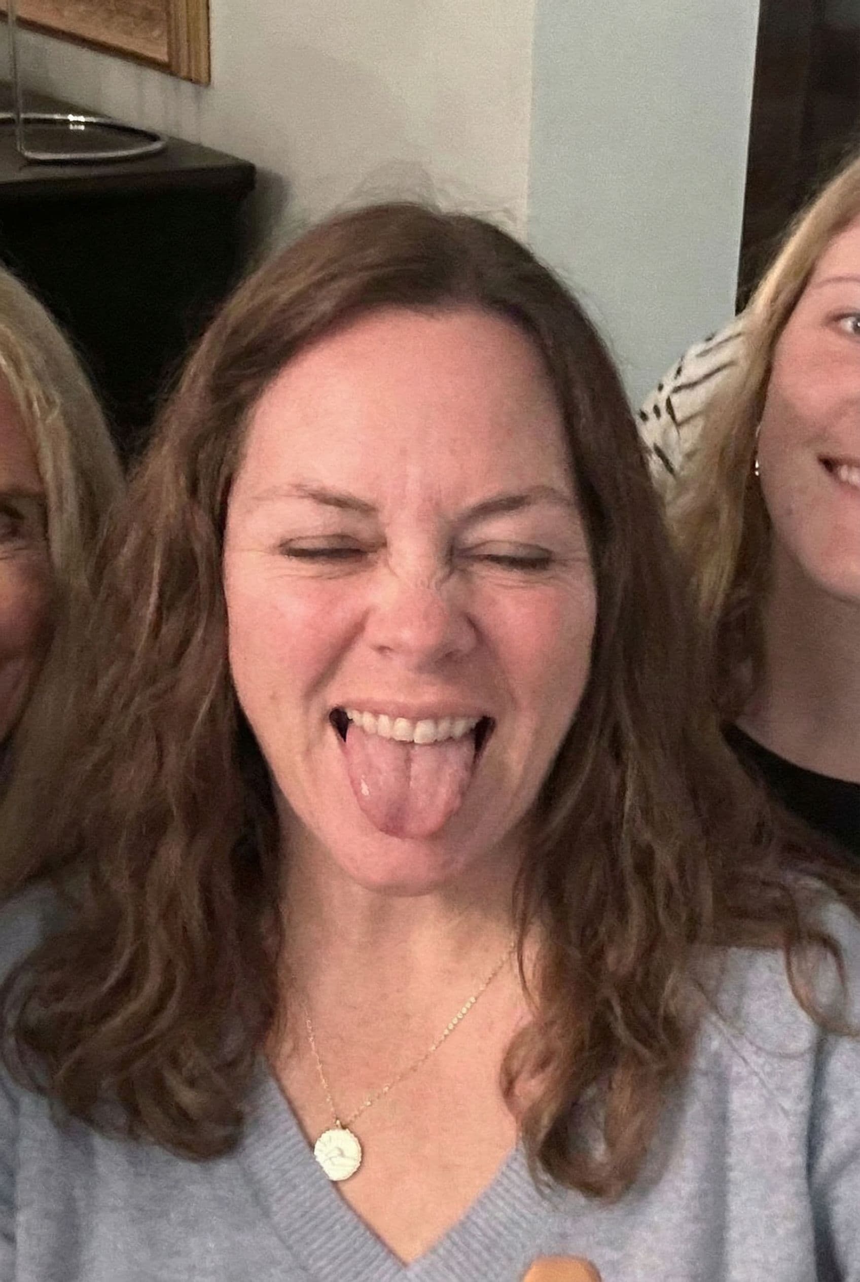 AI generated: Woman with eyes closed mouth opened with tongue out