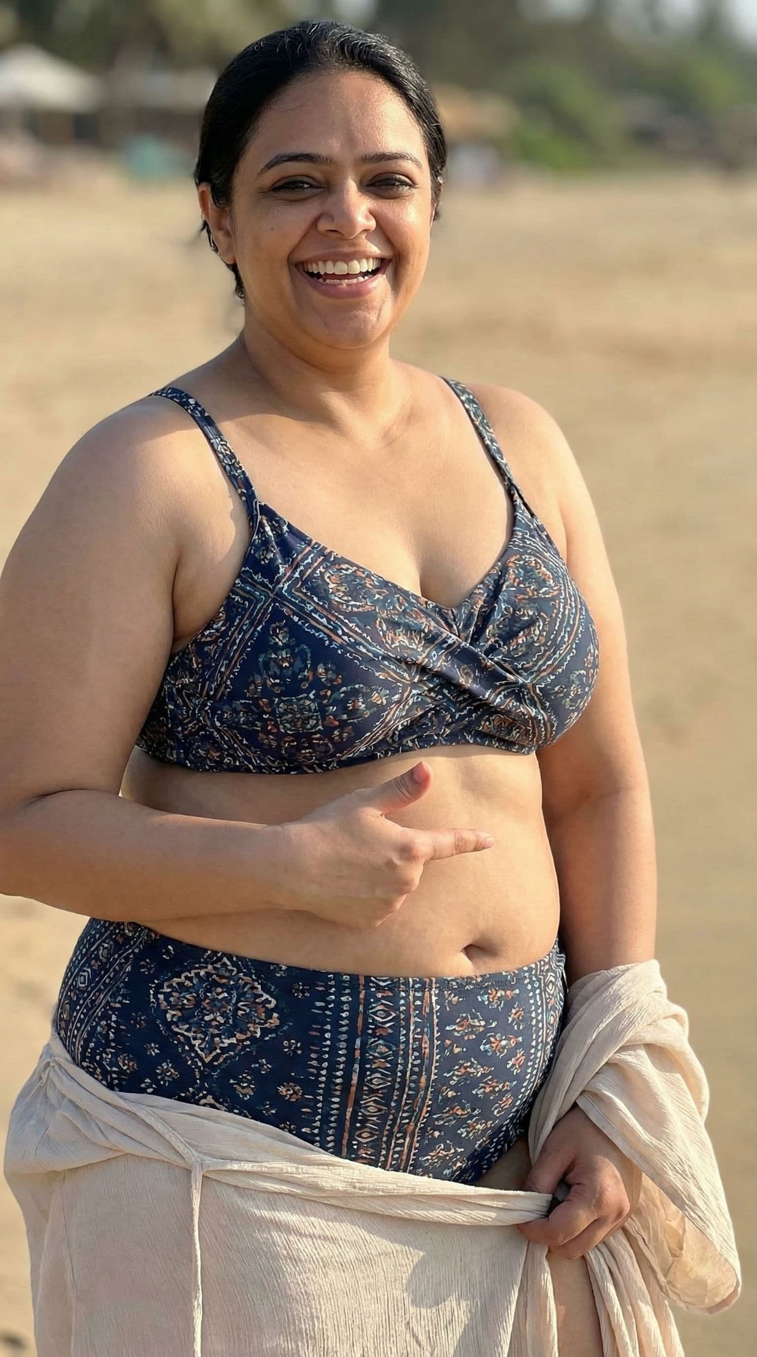 AI generated: She is wearing bikni and showing boobs, she is chubby, after that she shows body