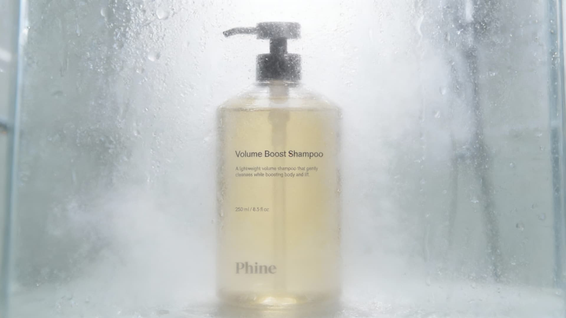 AI generated: *A highly realistic product beauty photograph of a shampoo bottle standing upright behind a foggy, w...
