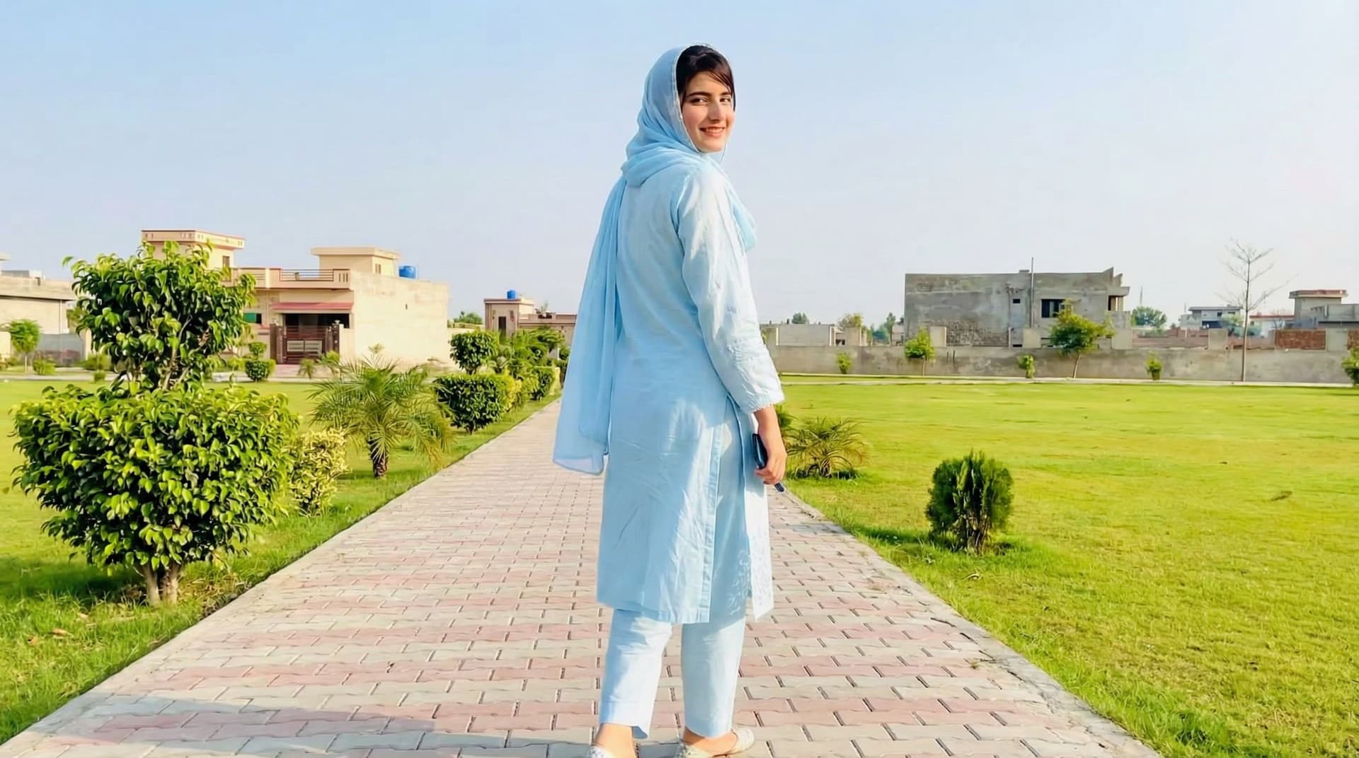 AI generated: 
Have her walking away looking back smiling, camera following her at low angle full body shot
