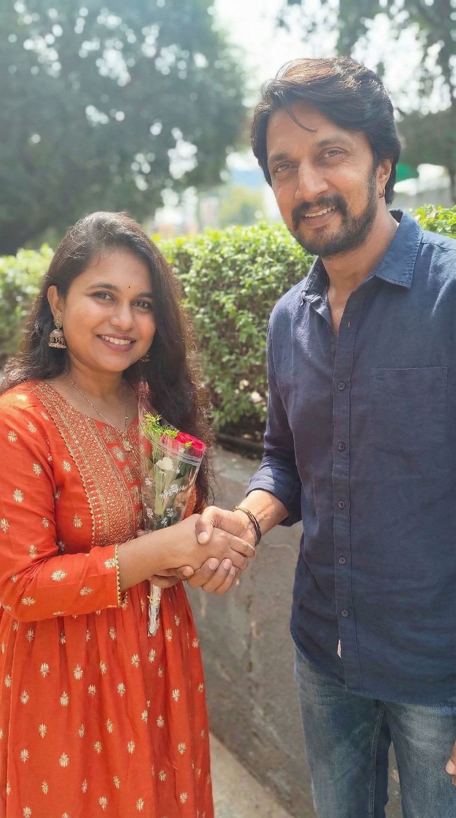 AI generated: Shaking hands with kichha sudeep 