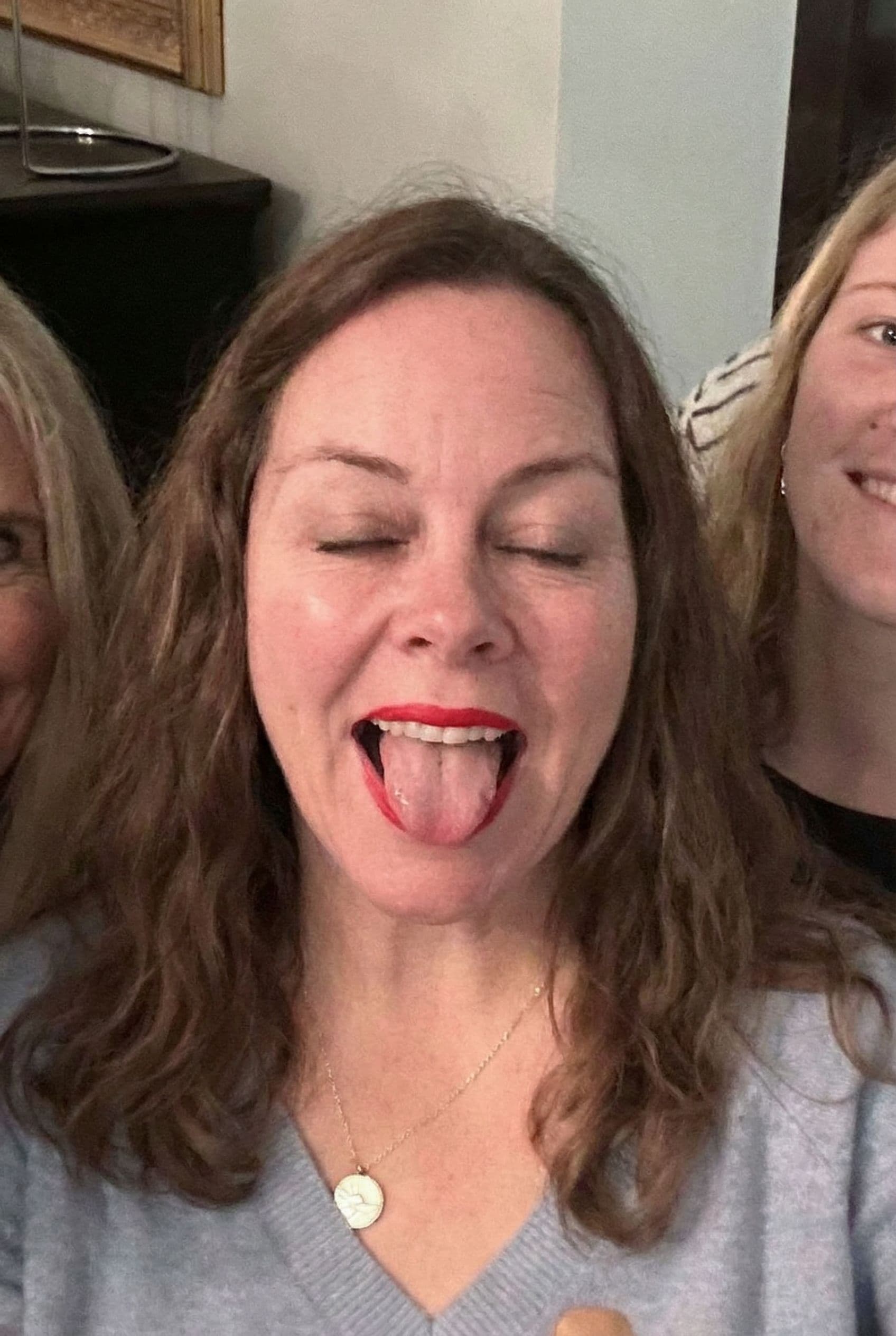 AI generated: Woman with eyes closed mouth opened tongue out with red lipstick