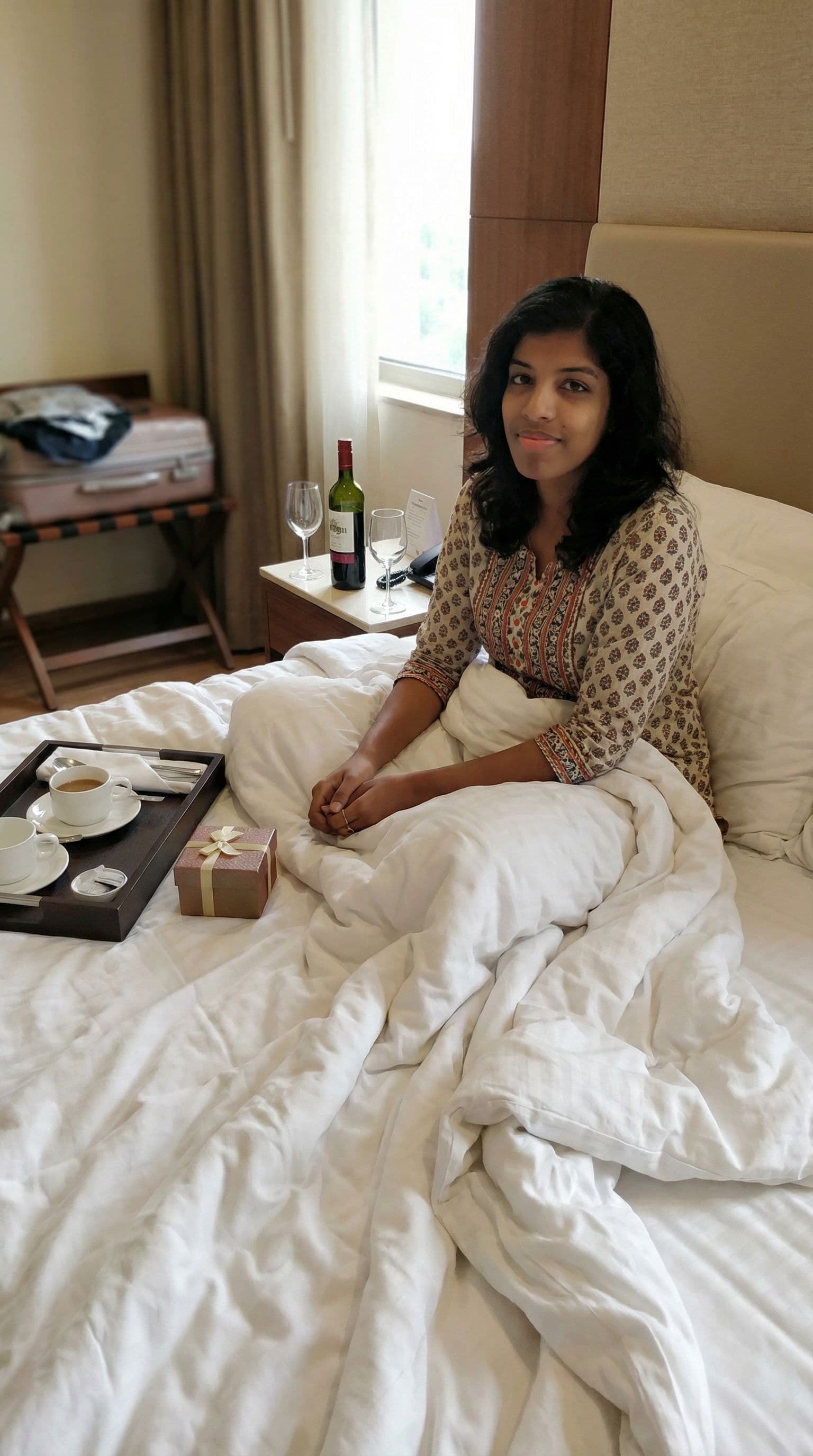 AI generated: A hotel room in girl with blankets and a affair things in that room 