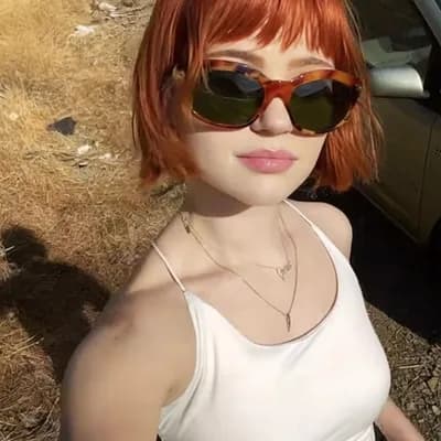 AI generated video: she  removes her clothes instantly and is completely topless naked and reveals her big saggy breasts...