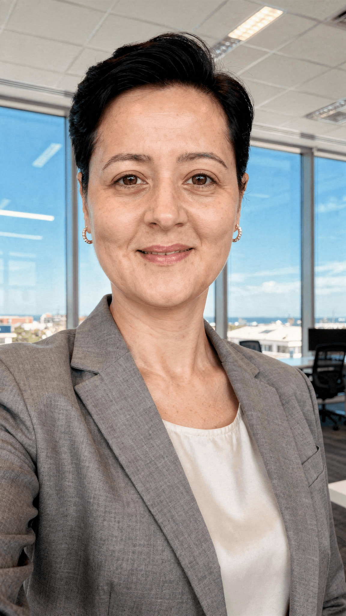 AI generated: generate a LinkedIn professional profile photo, wearing a beautiful blazer in an beautiful office se...