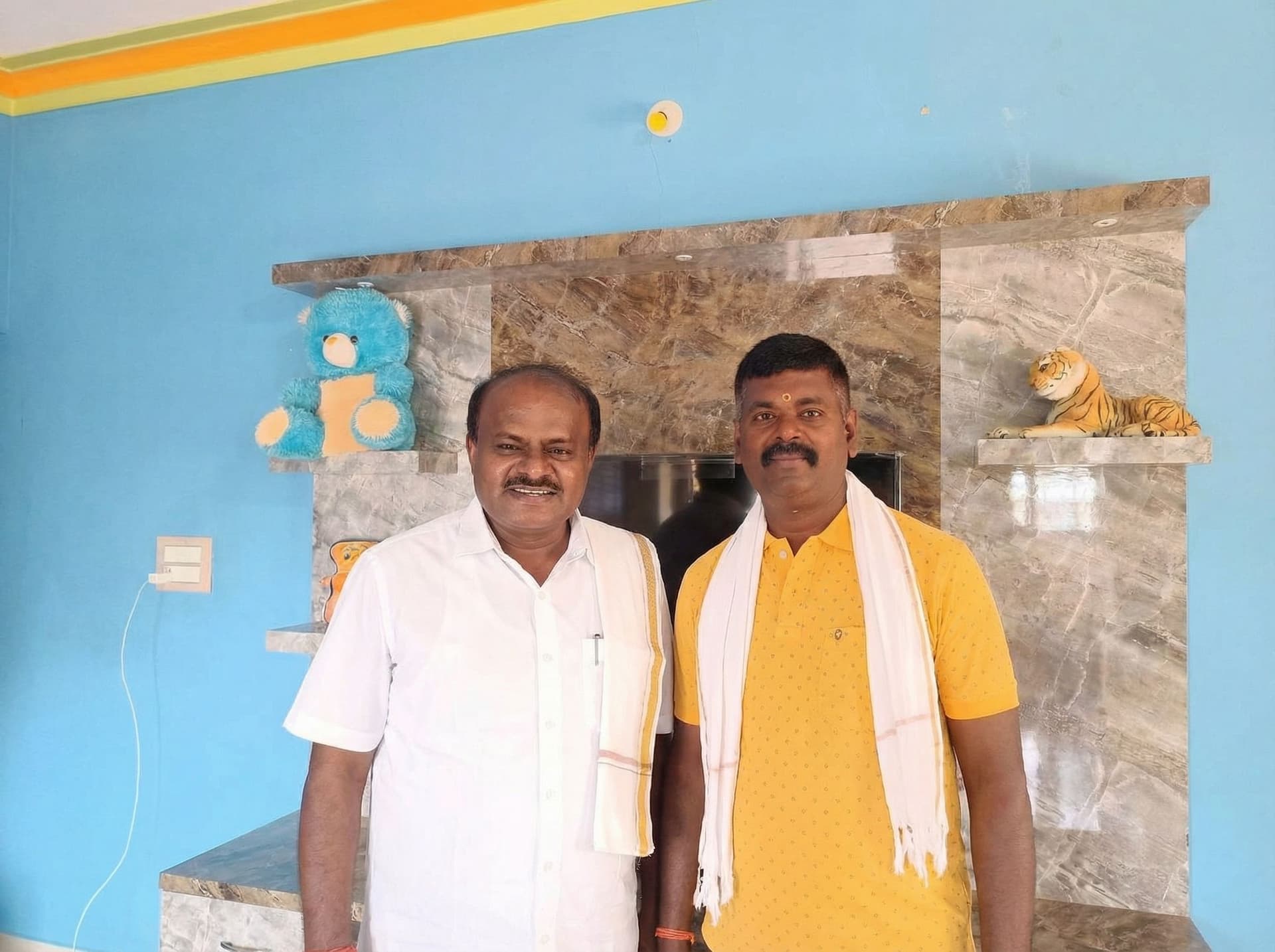 AI generated: Add HD Kumaraswamy cm puting and on me full screen 
