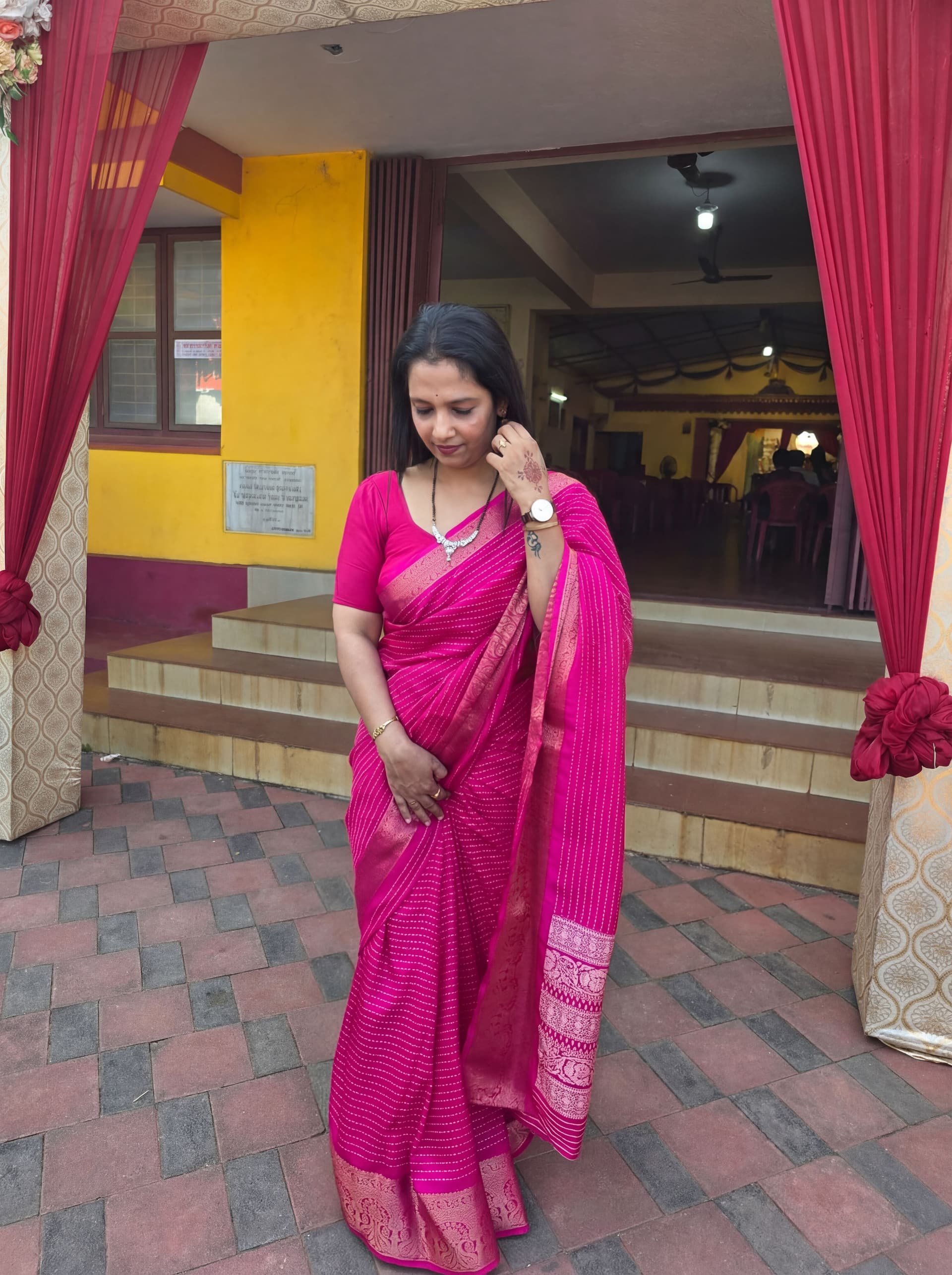 AI generated: Remove all the background human figure from the image keep only the main subject who has dressed in ...