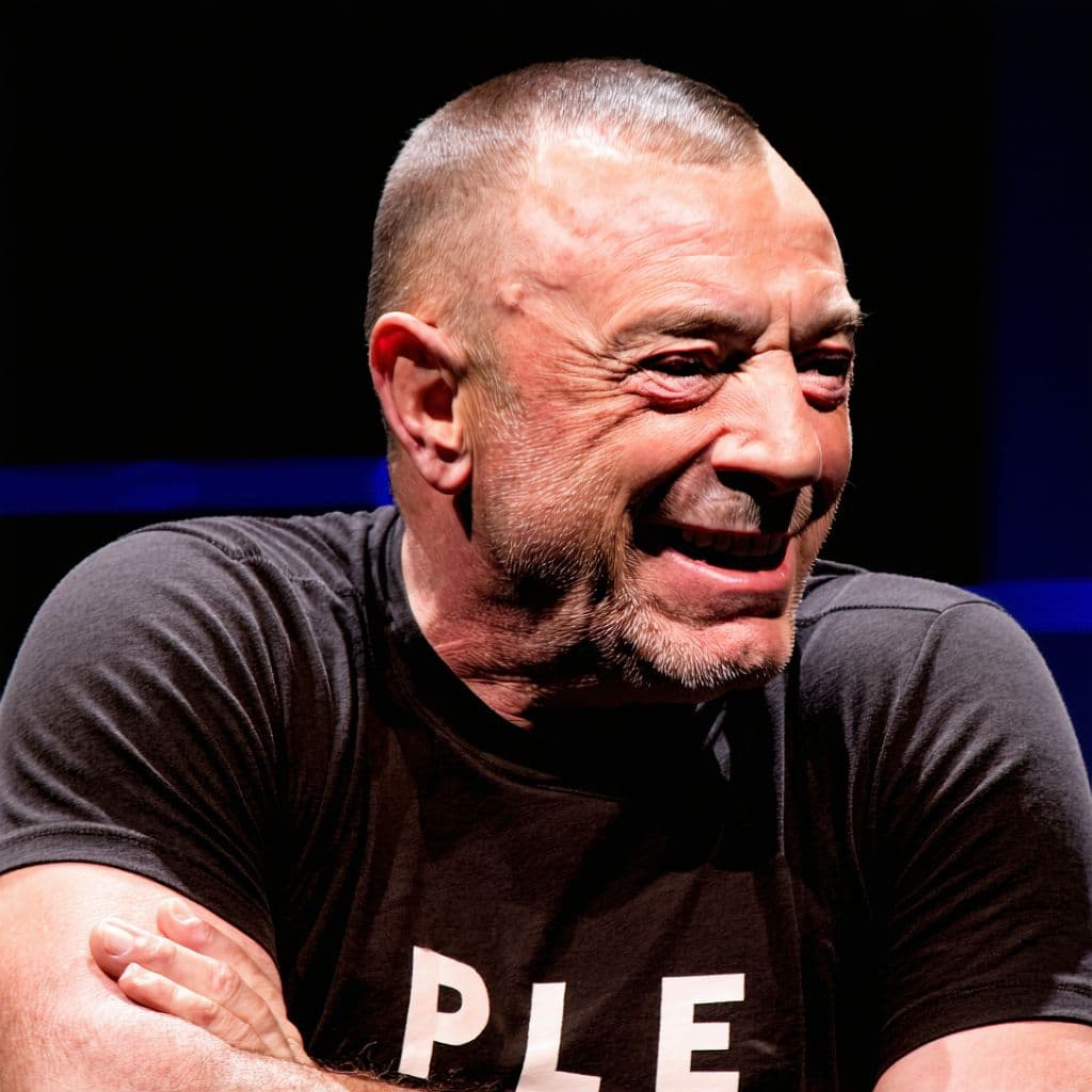 AI generated: Joe Rogan catches hitler breaking onto his set during a podcast and welcomes him