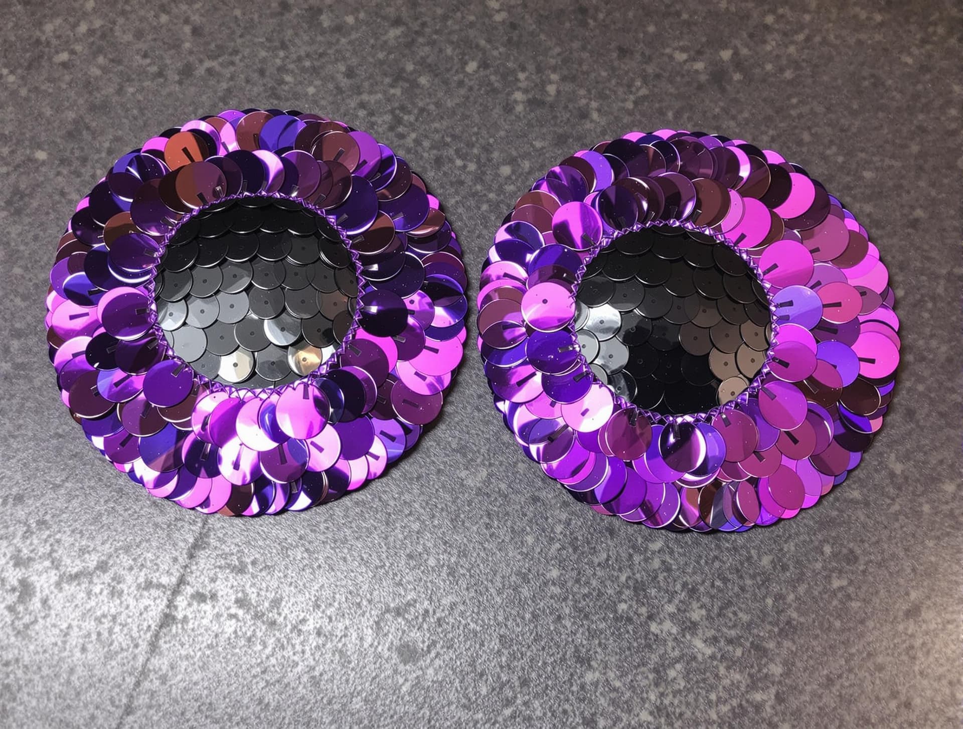 AI generated: Purple Sequin Bug Eyes