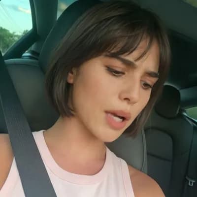 AI generated video: A highly realistic cinematic shot of a young woman, detailed skin texture, no filters. She looks nat...