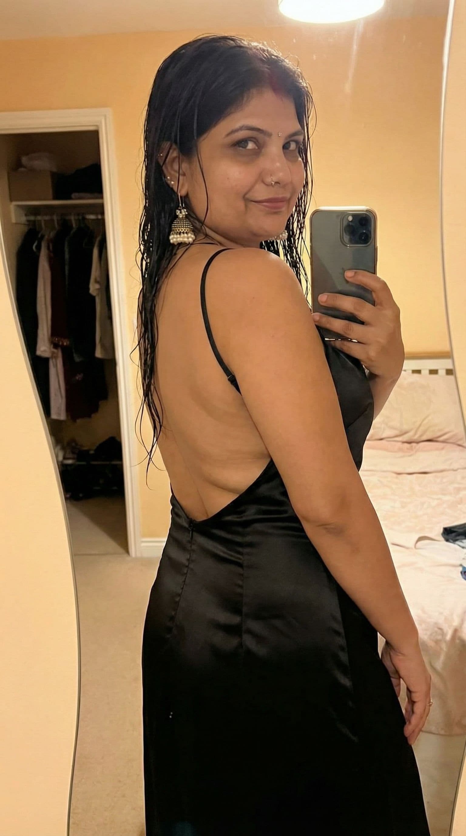 AI generated: Wearing backless dress taking a mirror selfie, seductive, fit