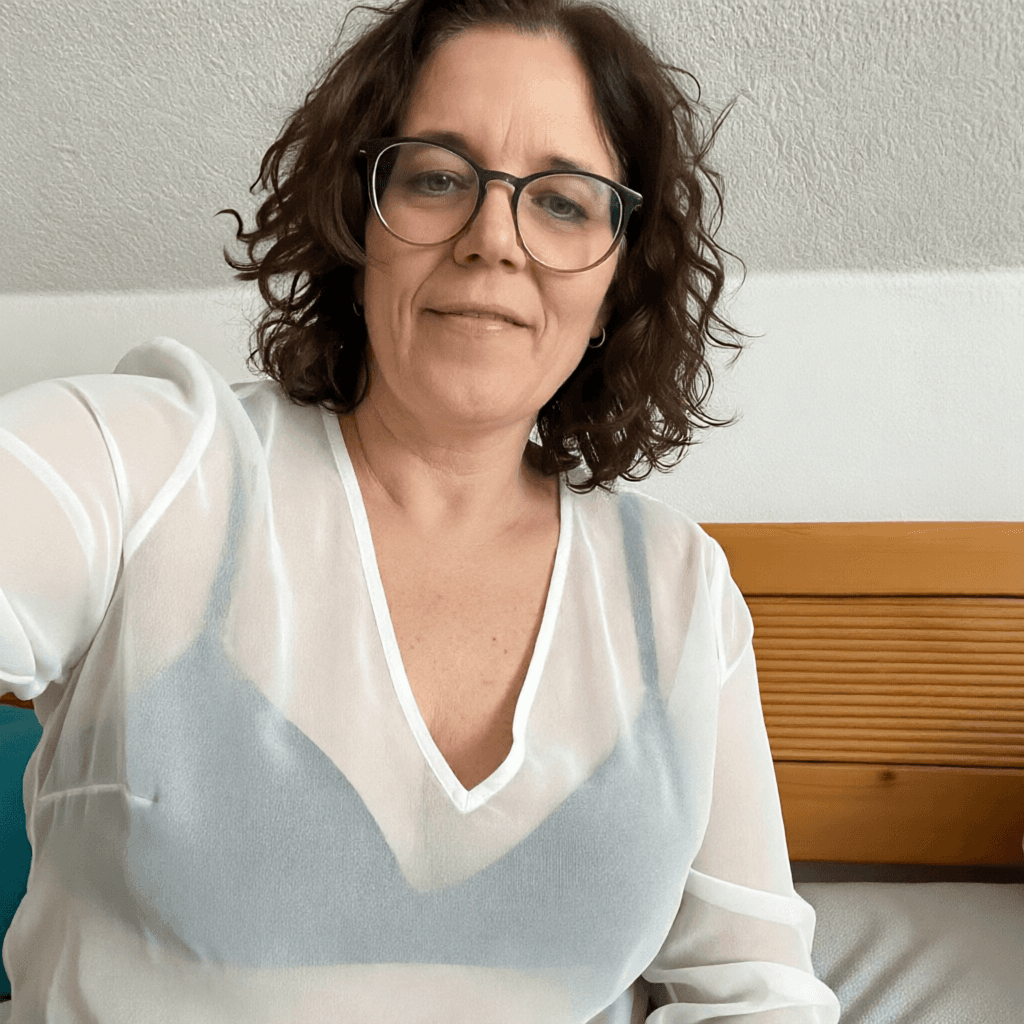 AI generated: White Transparent v neck blouse, black lingerie.