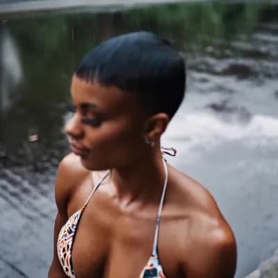 AI generated video: Beautiful muscular female with short haircut with huge breasts in bikini walk in raining day 