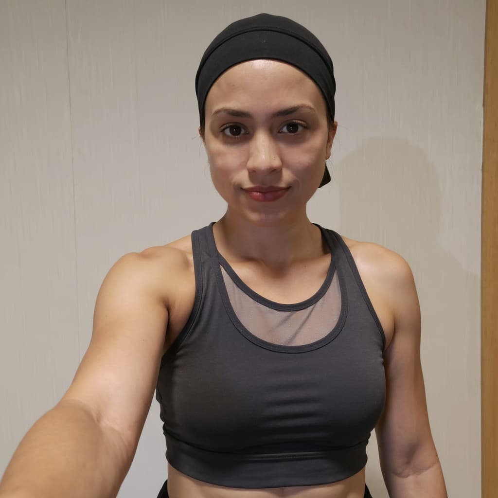 AI generated: change to gym cloth, remove hijab