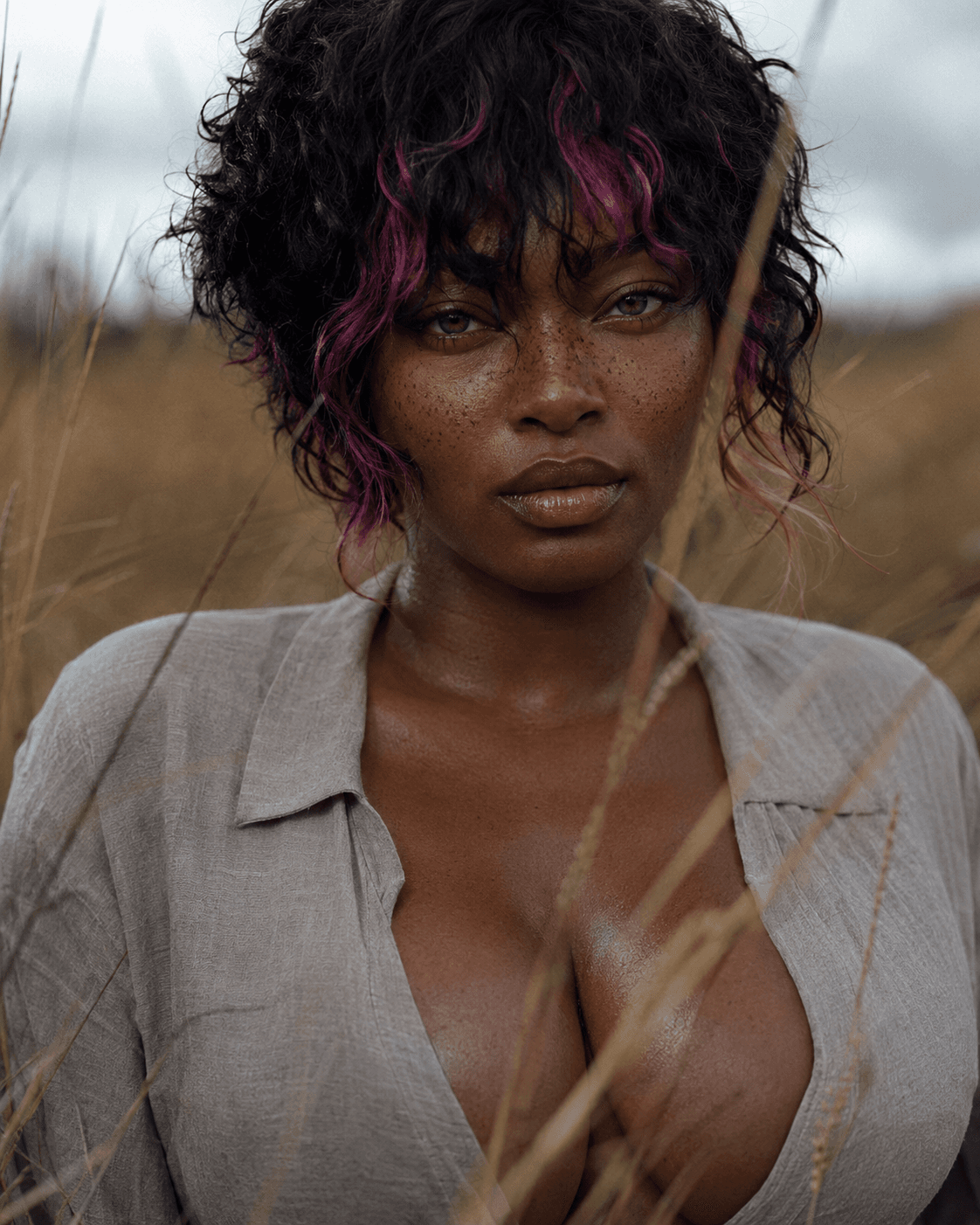 AI generated: Intimate close-up portrait in a quiet field, subject facing the camera directly with a calm serious ...