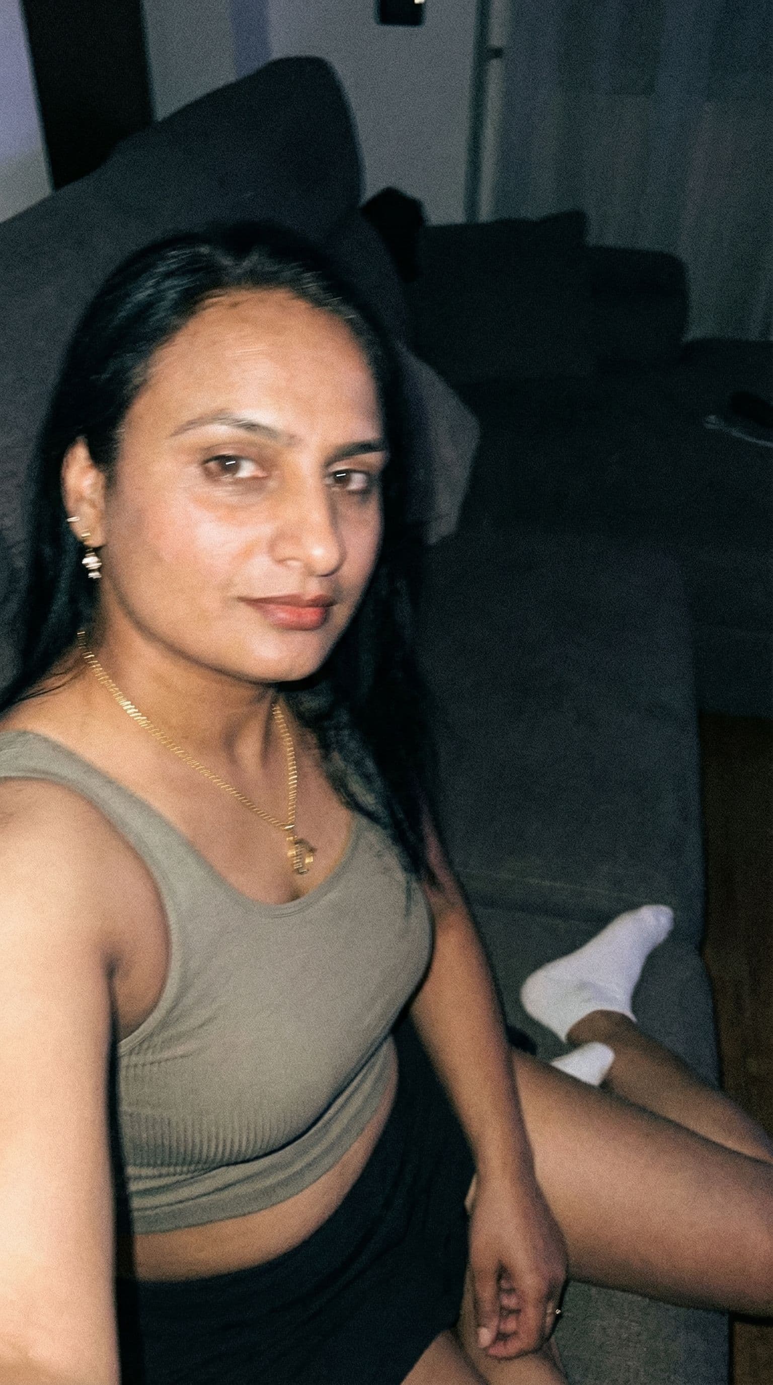 AI generated: Using the uploaded reference photo, create a standard iPhone selfie. There's no clear subject or fra...