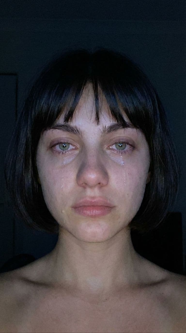 AI generated: A realistic close-up selfie shot of the same young woman from the reference image, captured front-fa...