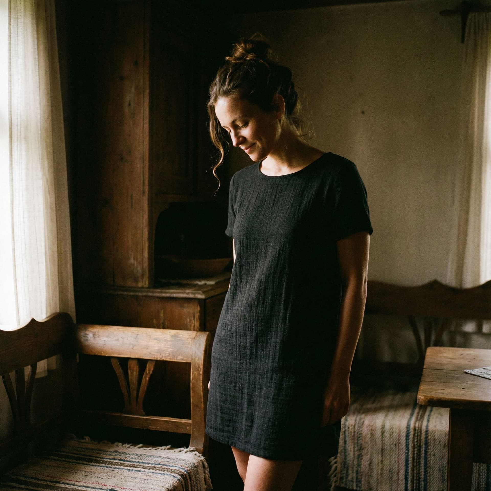 AI generated:  cinematic portrait of a woman standing in a dimly lit room, her body subtly angled as she looks dow...