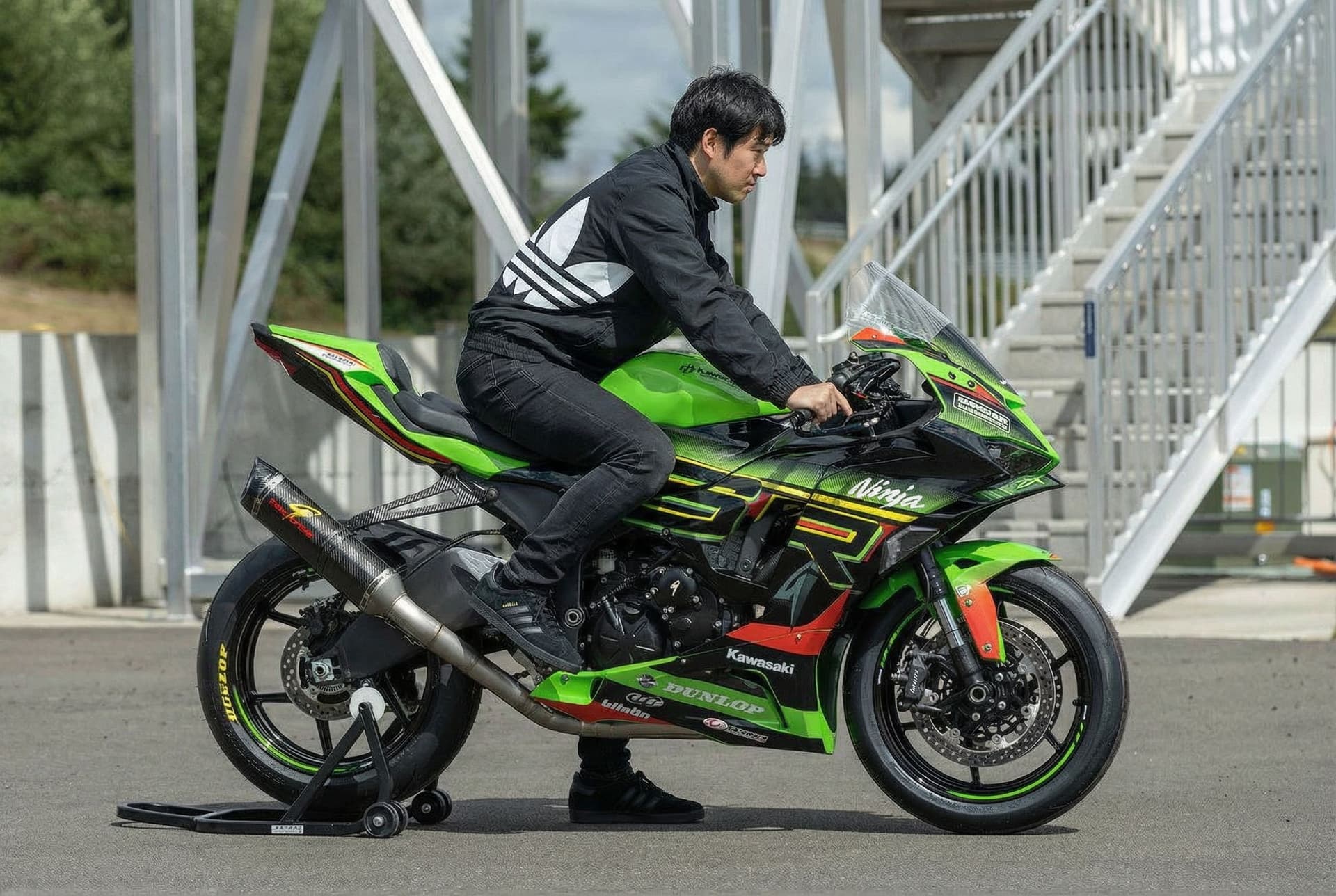 AI generated: Adding me on this bike wearing a big Adidas logo only on black jacket ( Adidas jacket ), black jeans...
