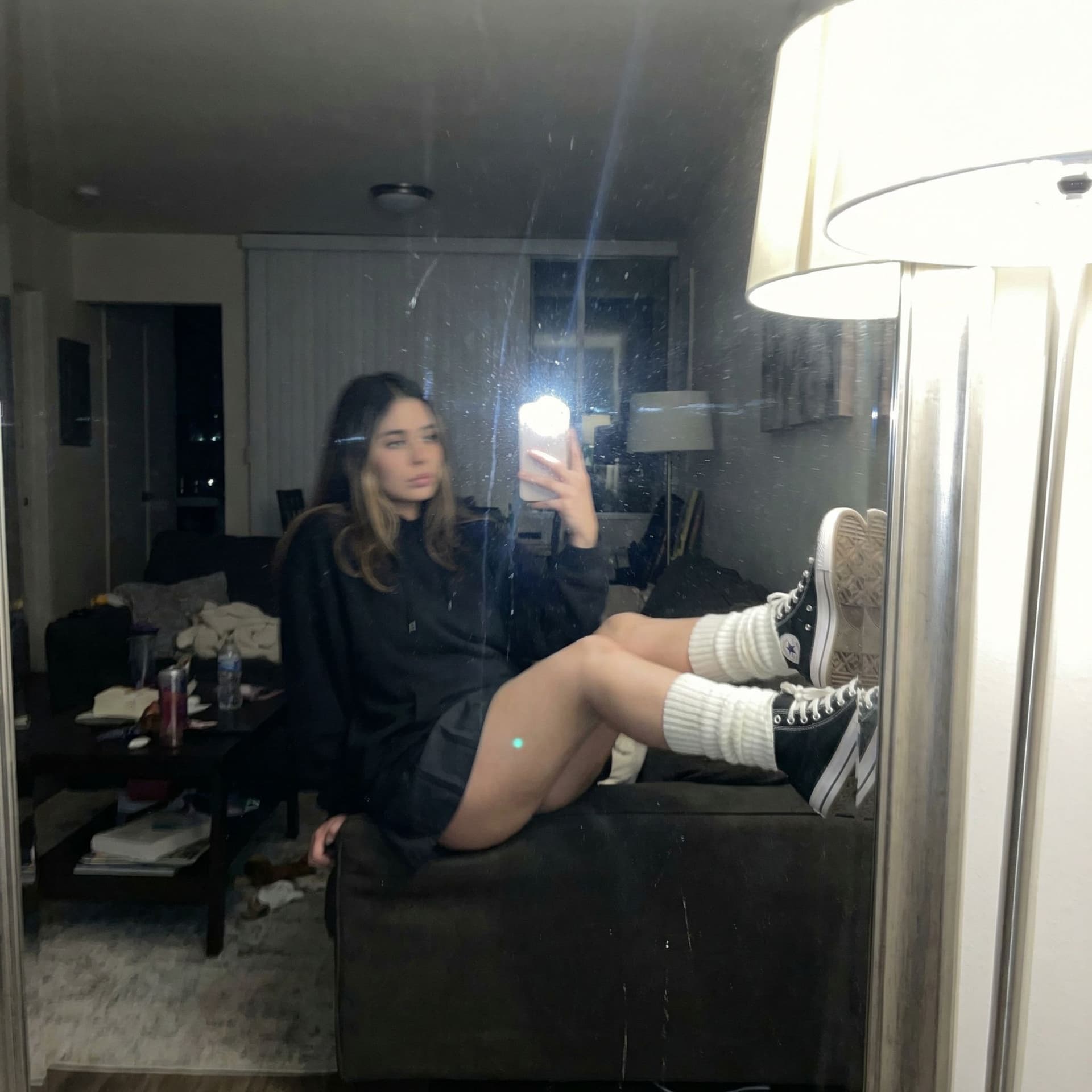 AI generated: An extremely unremarkable iPhone mirror selfie photo with no clear subject or framing—just a careles...