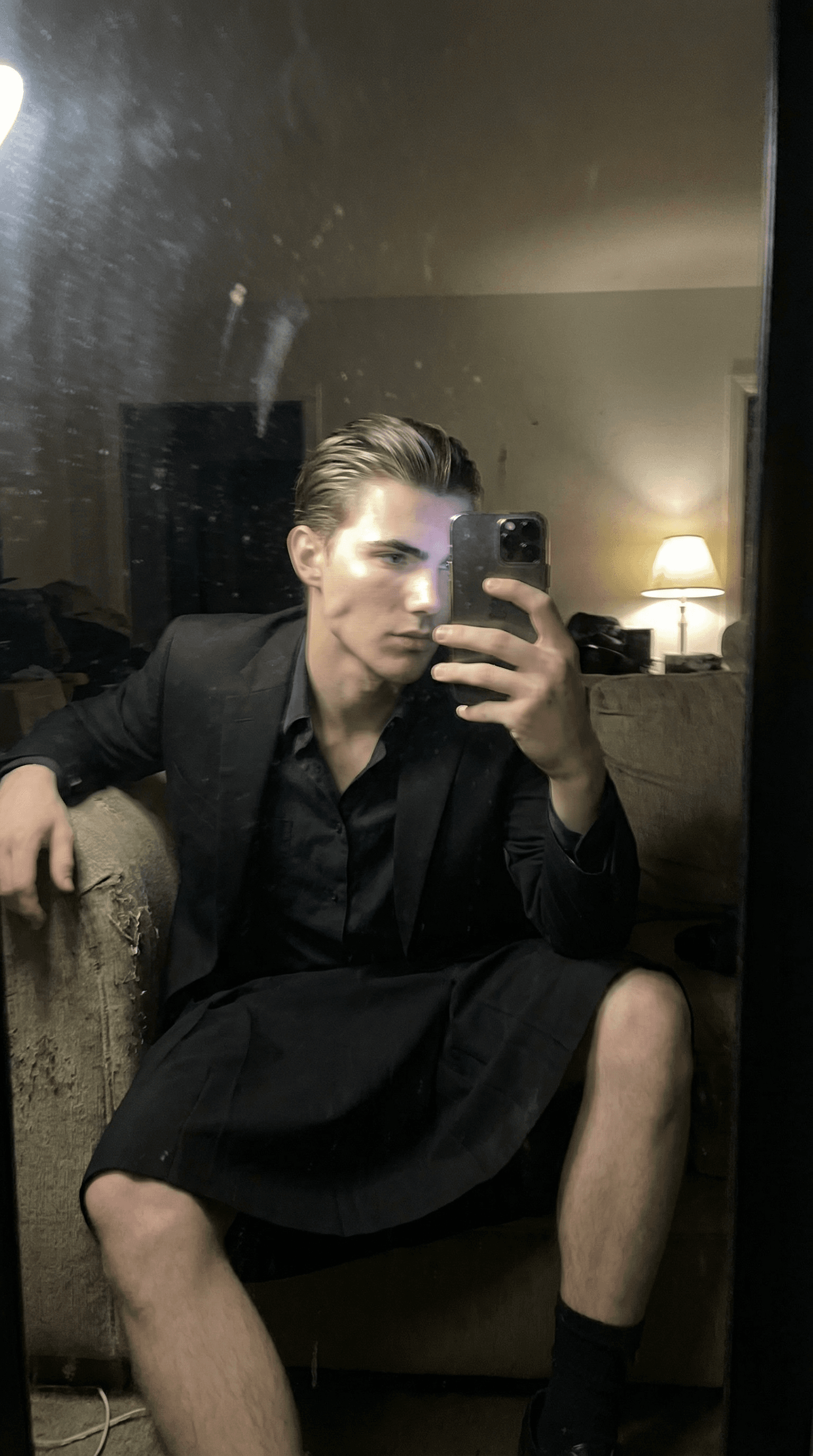AI generated: An extremely ordinary iPhone mirror selfie photo with no clear subject or framing—just a casually ta...