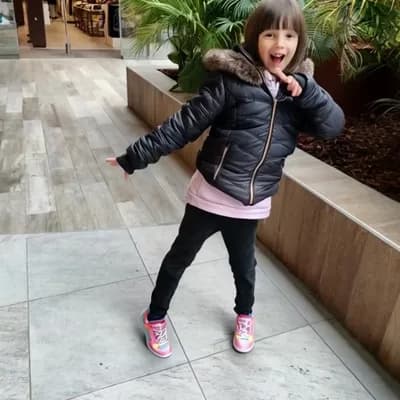 AI generated video: With a concentrated look on her face she looks to the right and to the left, then she looks straight...