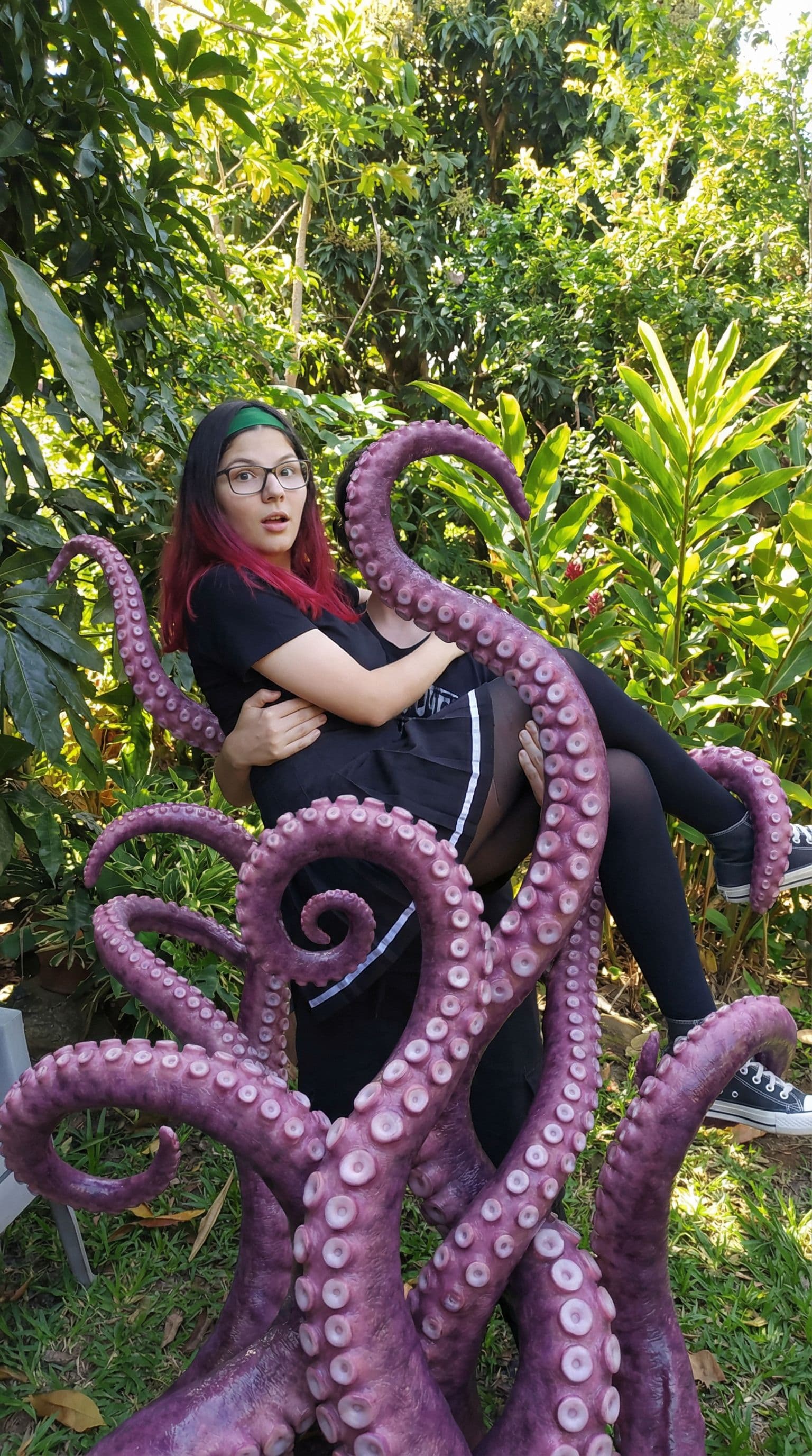 AI generated: a (image) of a woman giving (vaginal tentacle sex), many purple tentacles holding her up having sex ...
