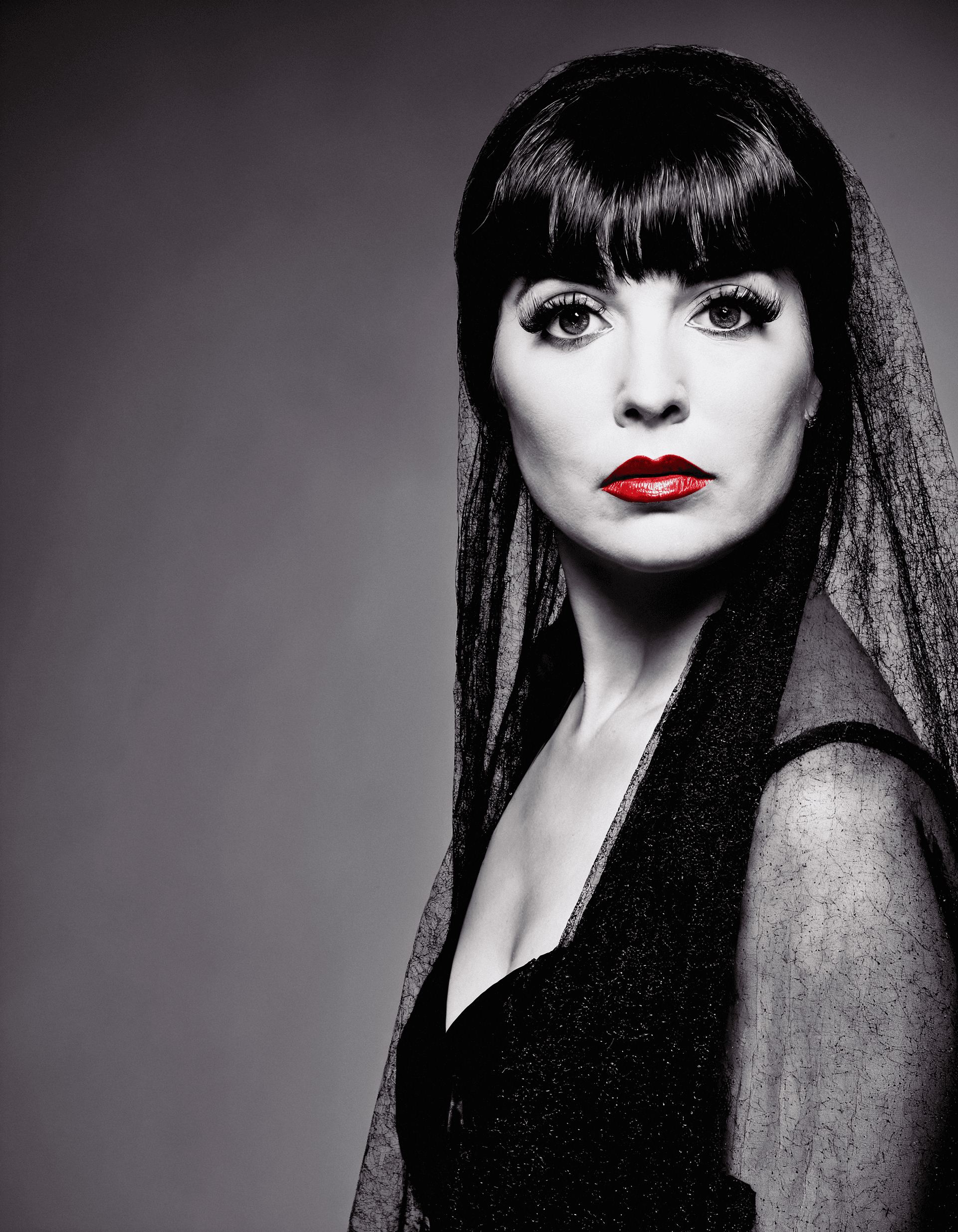 AI generated: dark background, full body standing naked woman in the 60s, saggy tits, dressed in a black veil and ...
