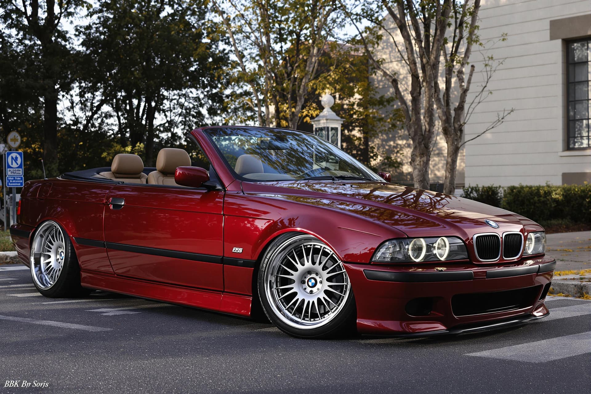 AI generated: dark red bmw e39 5-series convertible with bbs wheels, cinematic, hyper realism, high detail, 8k