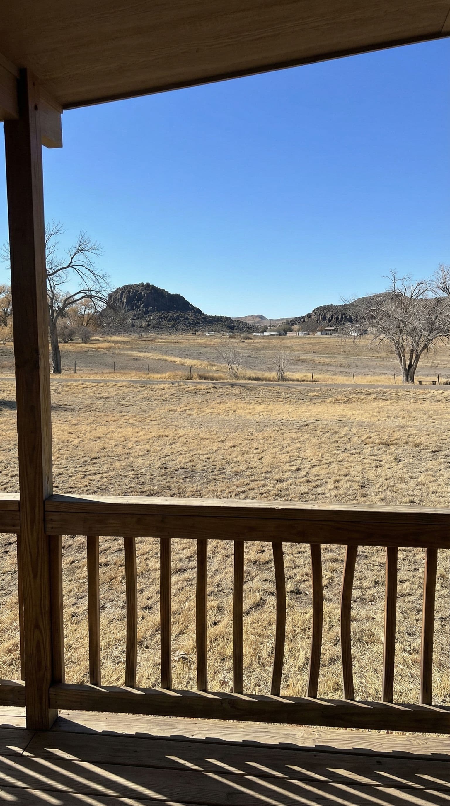 AI generated: The file i uploaded is the view from the street looking away from the house, the front porch is abou...