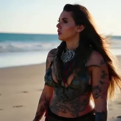 AI generated video: 2 viking warrior women with tattoos walking on the beach