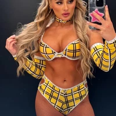 AI generated video: Looks seductively rubbing her boobs together.