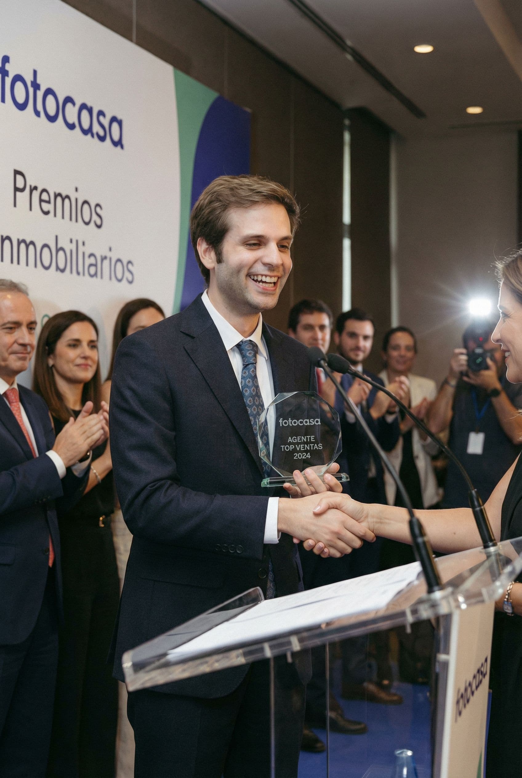 AI generated: The man is the top selling real estate agent of Fotocasa