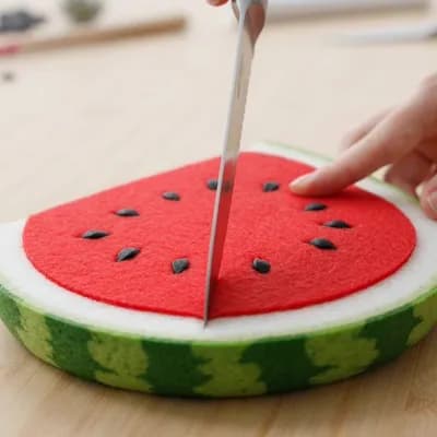 AI generated video: Slicing a felt watermelon 