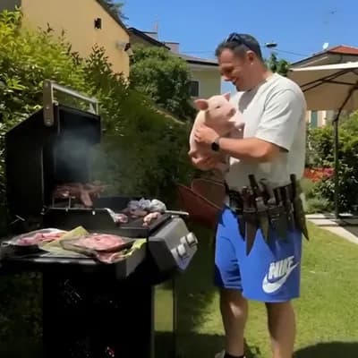 AI generated video: The man on video put the pig on the grill