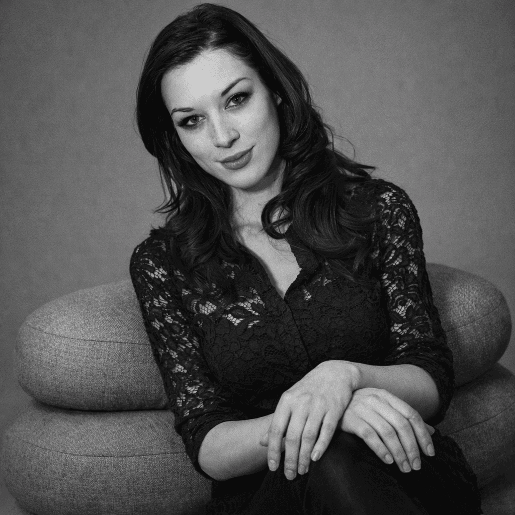 AI generated: Professional studio portrait of a woman. She is sitting on two stacked, modern, rounded grey cushion...