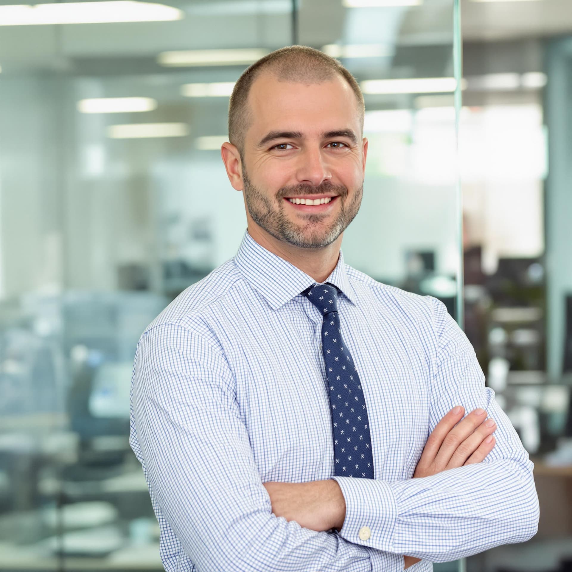 AI generated: clean shaven business man posing against office background